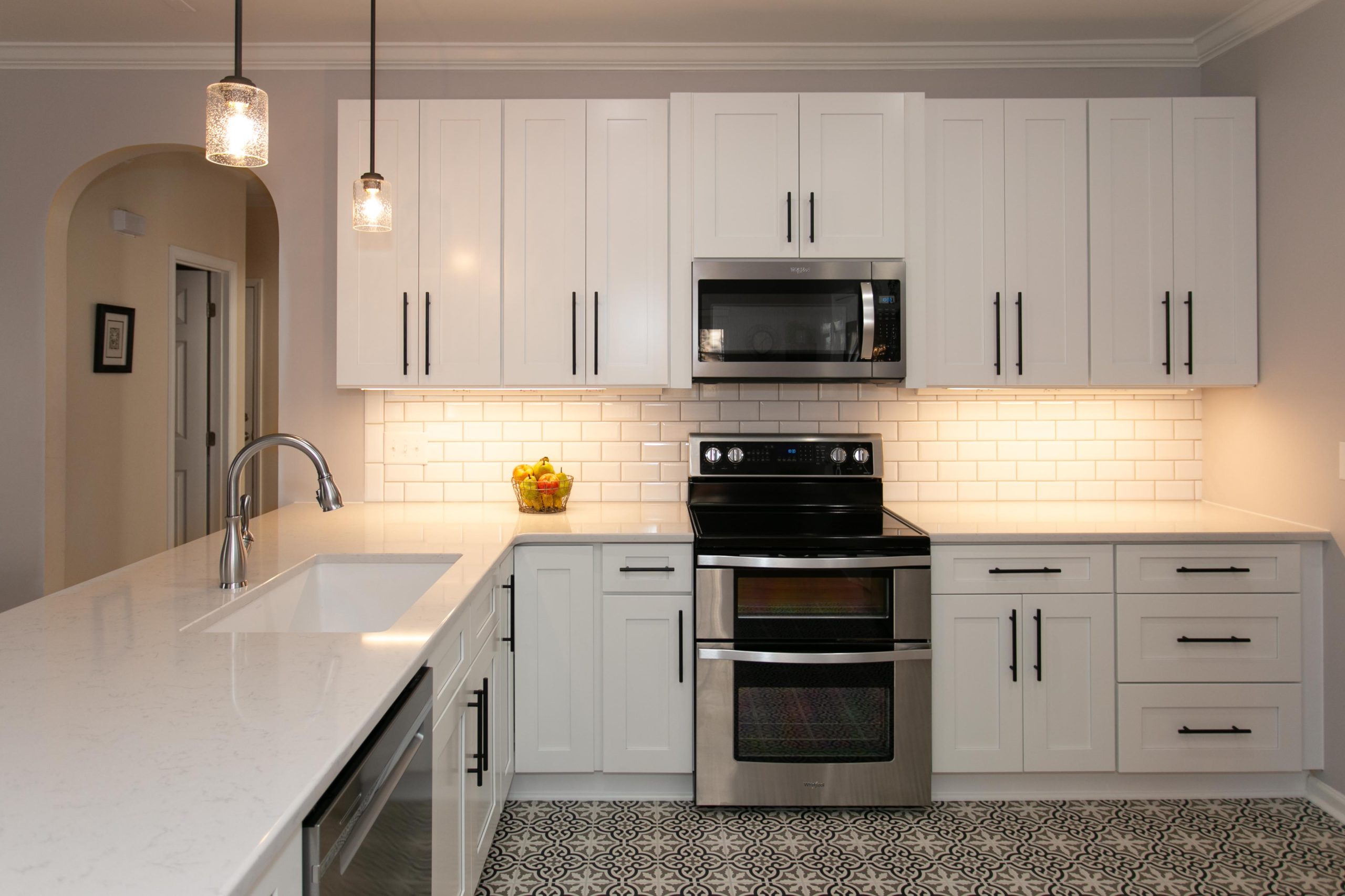 Apex Cozy Kitchen Remodel Open kitchen remodel with black and white spanish style designed floor tile